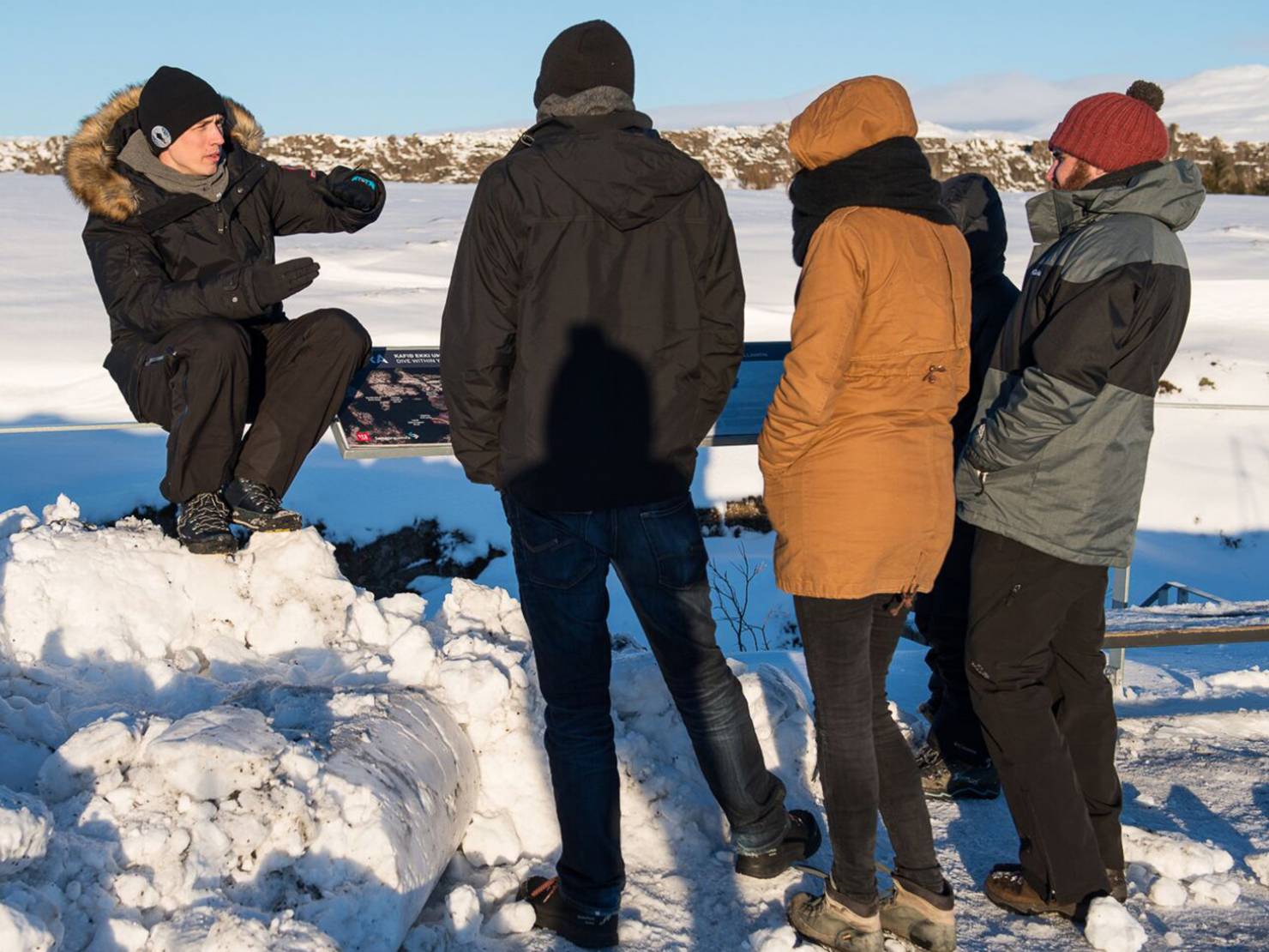 Our guide giving his customers a briefing before their snorkeling tour in Icelandic winter time Our guide giving his customers a briefing before their snorkeling tour in Icelandic winter time